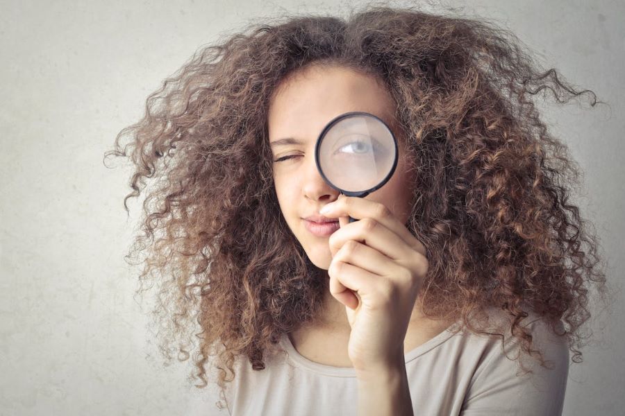 Girl with a magnifying glass