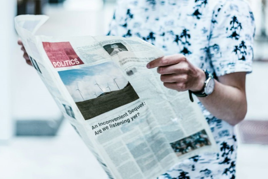 Person reading a newspaper