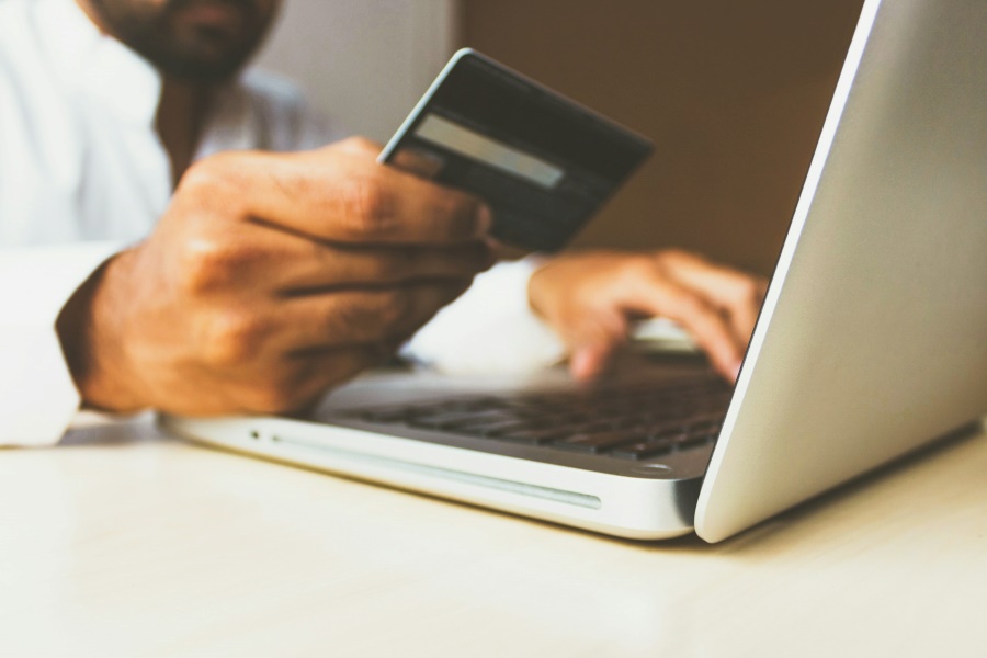 Person using a credit card to shop online